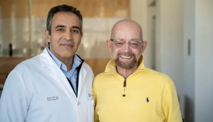 Paul Edmonds (right) with Ahmed M Aribi, who oversaw his cancer treatment. — CityofHope/File