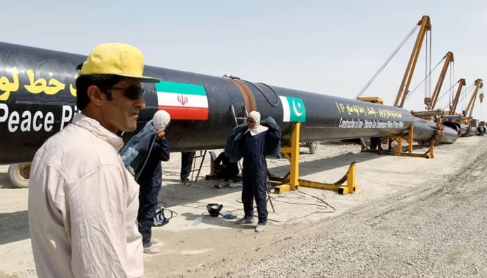Iranian workers are seen working on the Pak-Iran gas pipeline project. — AFP/File