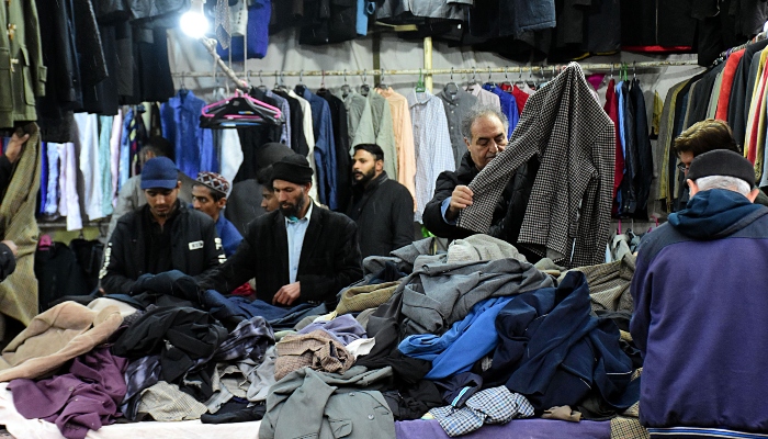 People are busy in purchasing warm clothes due to cold weather at Aabpara Sunday weekly bazaar during rain in the Federal Capital on February 8,2024. —Online