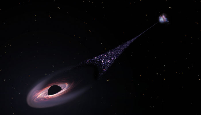 This is an artists impression of a runaway supermassive black hole that was ejected from its host galaxy as a result of a tussle between it and two other black holes. — Nasa/File
