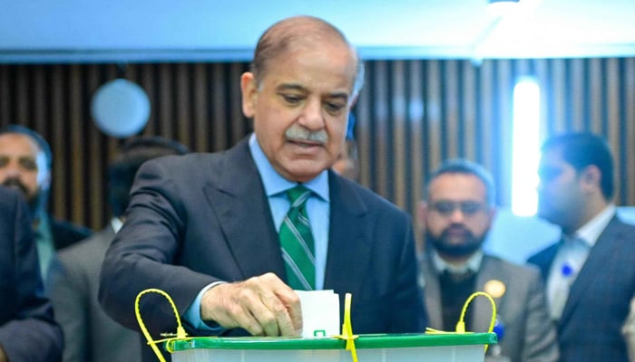 Prime Minister Shehbaz Sharif casts his vote during the presidential election in the National Assembly, on March 9, 2024. — X/@NAofPakistan
