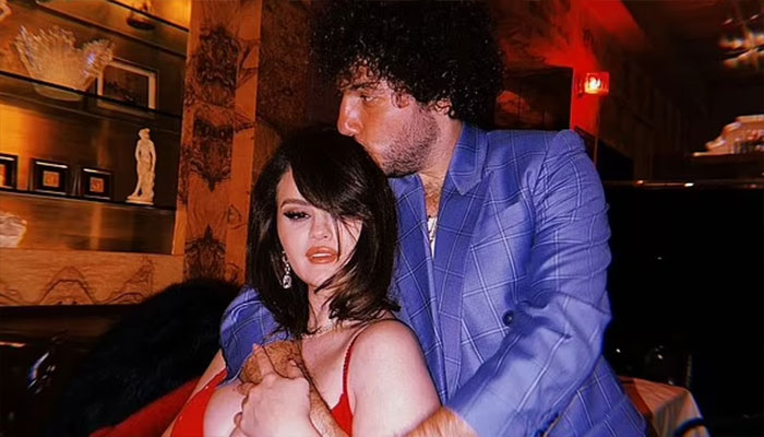 Selena Gomez dazzles in low-cut red gown during with friends.