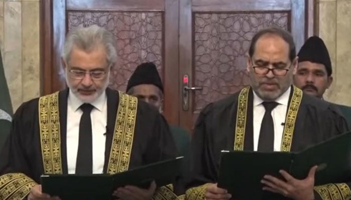 CJP Qazi Faez Isa (left) administers the oath to Justice Naeem Akhtar Afghan as a Supreme Court judge in Islamabad on March 11, 2024. — Screengrab/YouTube/PTV News Live Stream
