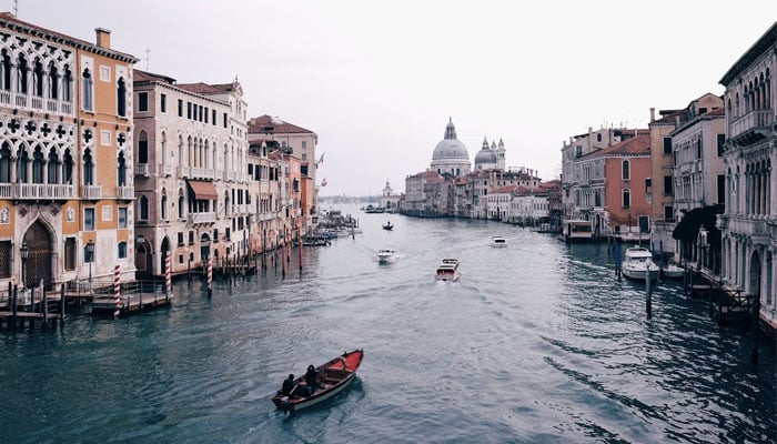 The image shows a lake in Venice. Italy. — Unsplash