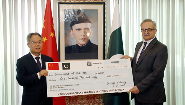 Chinese Ambassador Jiang Zaidong (left) hands over $100,000 cash assistance to Foreign Secretary of Pakistan Mohammad Syrus Sajjad Qazi on March 14, 2024. — Supplied