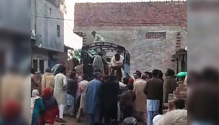 Stampede can be seen during ration distribution under Ramadan Nigehban Relief Package in Lahore on January 13, 2024, in this still taken from a video. — Reporter