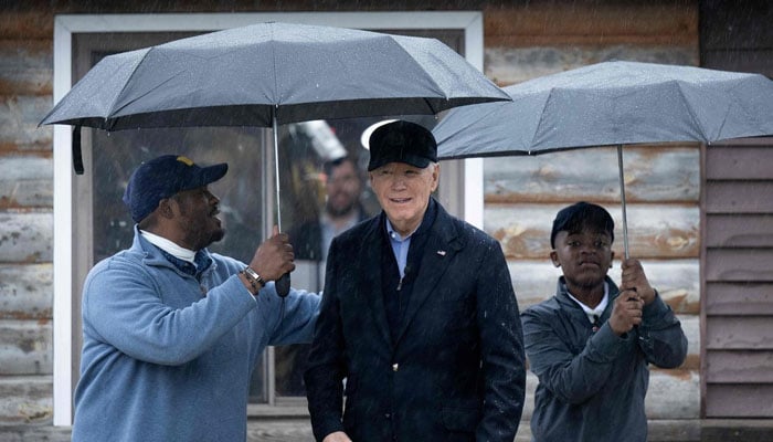 President Joe Biden gestures for a photograph in Saginaw. — AFP/File