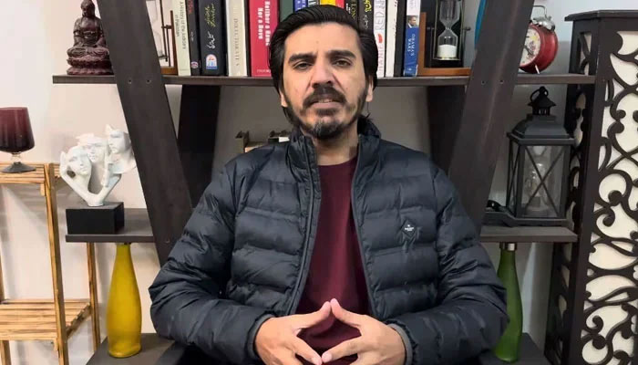 Vlogger Asad Toor speaks during his YouTube show in this still taken from a video uploaded on February 25, 2024.