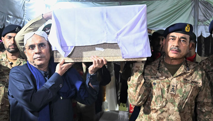 President Asif Ali Zardari (left) and COAS General Asim Munir carry the body of a martyred soldier after offering funeral prayers at Rawalpindis Chaklala Garrison on March 16, 2024. — X/@@PTVNewsOfficial