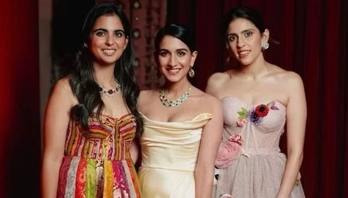 Isha Ambani poses with her sisters-in-law Radhika Merchant and Shloka Mehta at Roman Holi bash. — Instagram/@instantbollywood