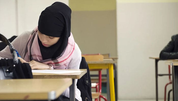 A Muslim faithful student is pictured in her classroom at the La Reussite Muslim school on September 19, 2013 in Aubervilliers, outside Paris. — AFP
