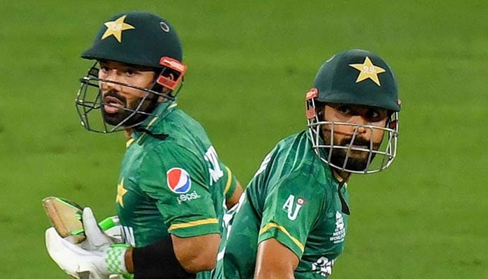Pakistani batters Babar Azam (right) and Mohammed Rizwan look on while taking a run during a match. — AFP/File