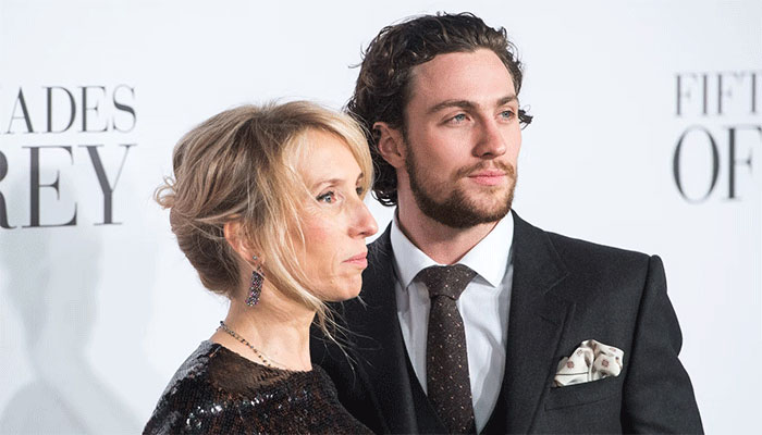 Aaron Taylor-Johnsons real-life bond girl Sam turns heads in London stroll.