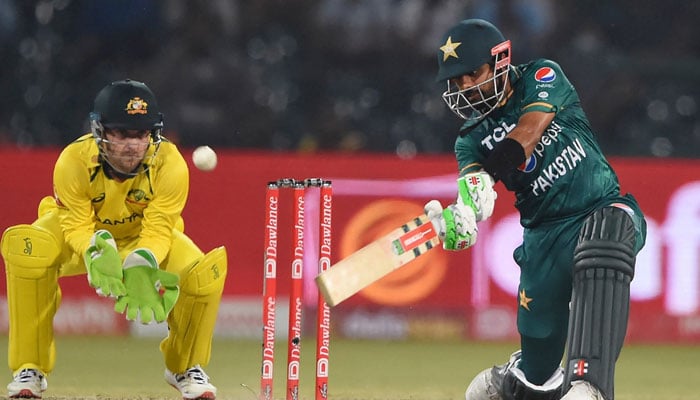 Pakistans Babar Azam (right) plays a shot during the T20I cricket match between Pakistan and Australia. — AFP/File