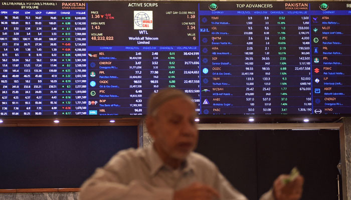 A stock broker watches share prices during a trading session at the Pakistan Stock Exchange (PSX) in Karachi on July 31, 2023. — AFP