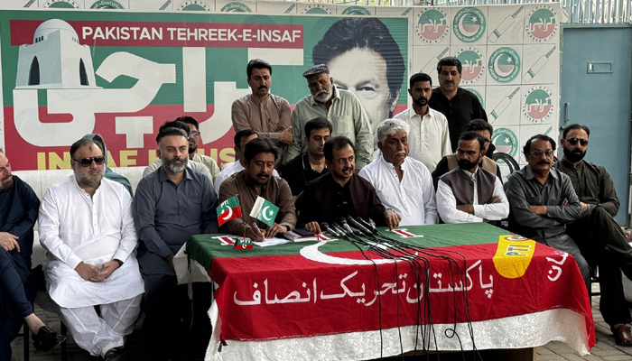 PTI leader Haleem Adil Sheikh (centre) is addressing the press conference in Karachi on March 31, 2024. — X/@PTIKarachi