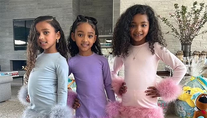 Kardashian cousins channel girl group vibes in adorable feather-trimmed dresses.