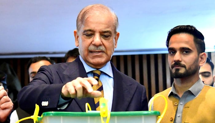 Prime Minister Shehbaz Sharif casting vote in Senate elections at Parliament House in Islamabad on April 2, 2024. — PID