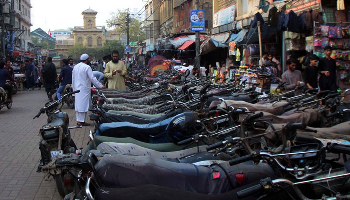 Dozens of motorcycles can be seen parked at Karachis Bohri Bazar on March 14, 2024. — PPI