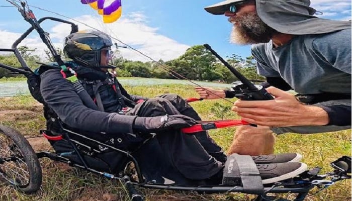 Ajmal Samuel, a Hong Kong-based special athlete of Pakistani origin, takes instructions from his paragliding trainer Matthew Van Zyl. — Supplied