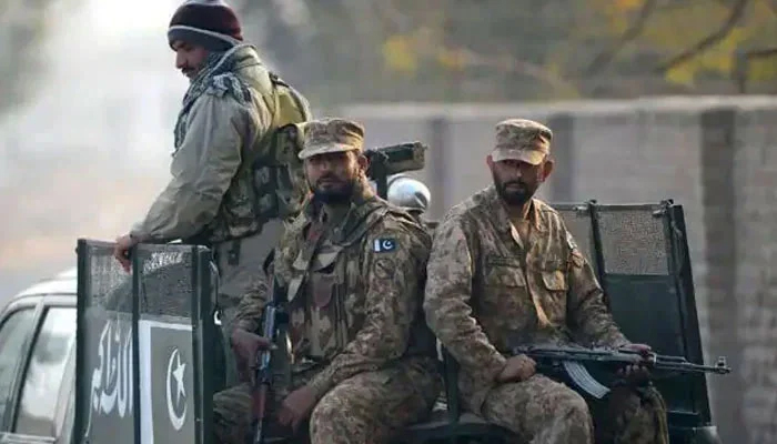 Pakistan Army soldiers ride on a military vehicle in this undated image. — AFP/File