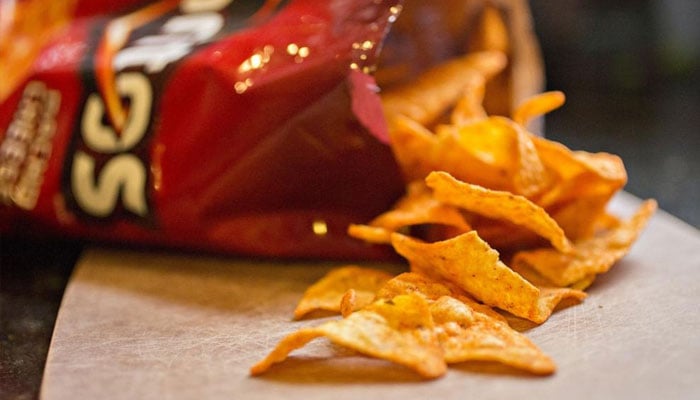 Experts warn of hidden risks in salt-laden processed foods. (In this Sept. 28, 2016, file photo, a bag of Doritos brand snack chips is shown. — Bloomberg)