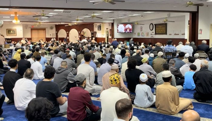 People attend Eid al-Fitr at a mosque in the United States. --reporter