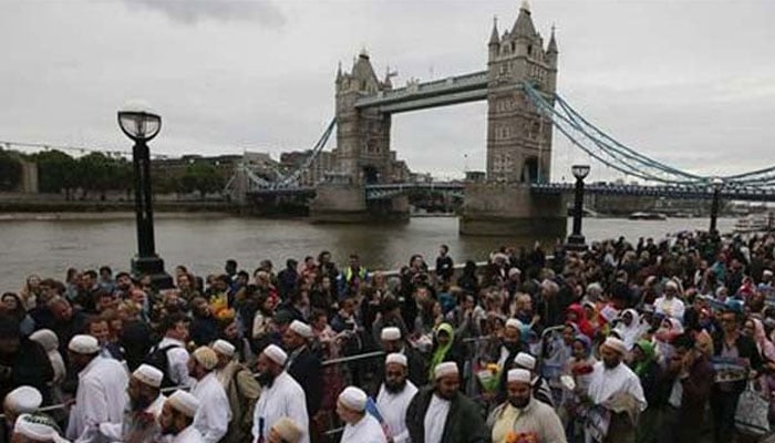 A representational image showing a large number of people including Muslims in London. — AFP/File