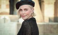 Charlize Theron Spotted Front Row With Daughter August At Dior Fashion Show