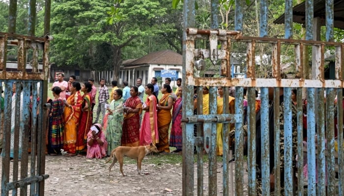 People queue to cast their votes in the countrys West Bengal state on April 19, 2024. —AFP