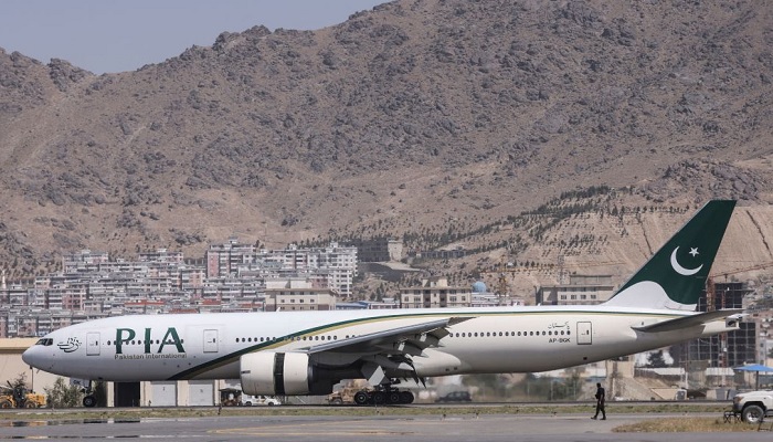 A Pakistan International Airlines passenger jet is parked on the tarmac o Kabul Airport. —AFP/File