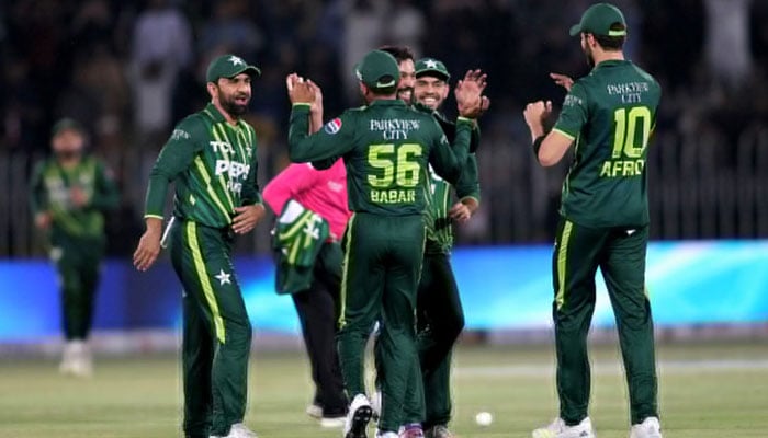 Pakistani players celebrate together after taking a wicket during second T20I at Pindi Cricket Stadium on April 20, 2024. — PCB