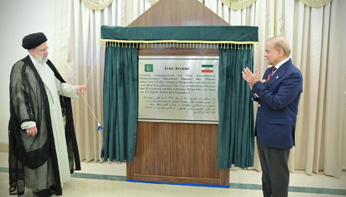 Iranian President Seyyed Ebrahim Raisi (left) and Prime Minister Shehbaz Sharif unveiling plaque of renaming an avenue of Islamabad as Iran Avenue, on April 22, 2024. — X/@PakPMO