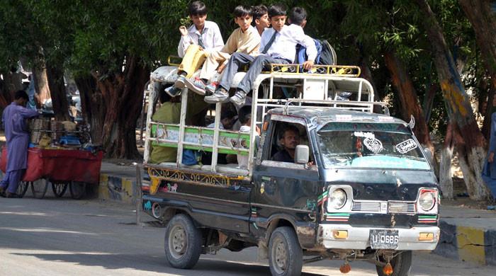 Van drivers drop schoolchildren home amid blocked roads in Karachi