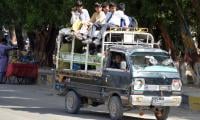 Van Drivers Drop Schoolchildren Home Amid Blocked Roads In Karachi