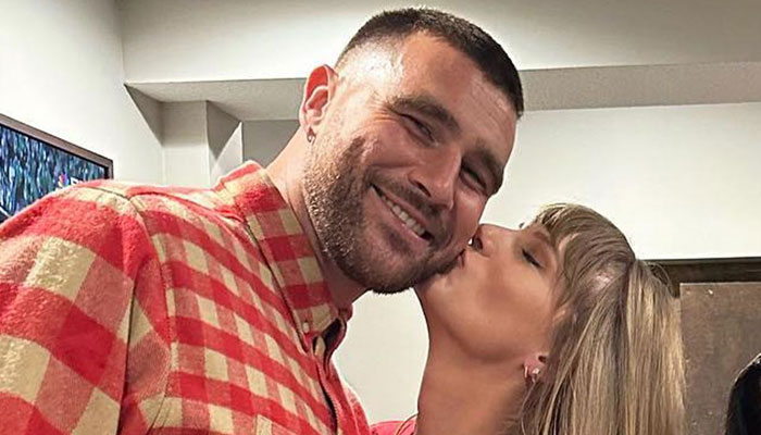Travis Kelce and Taylor Swift enjoy a rare PDA moment