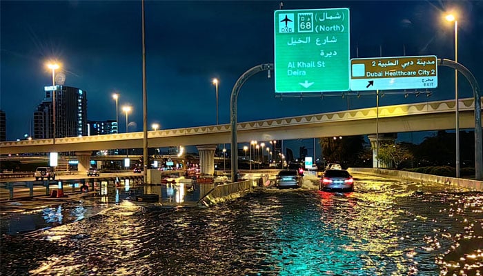 Motorists drive along a flooded street following heavy rains in Dubai. The Middle Easts financial centre, has been paralysed by the torrential rain that caused floods across the UAE and Bahrain and left 18 dead in Oman on April 14 and 15. — AFP