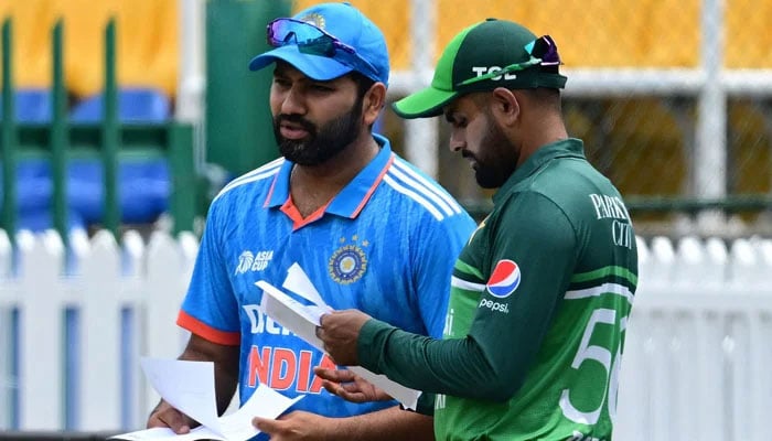 Indias captain Rohit Sharma (left) and Pakistans captain Babar Azam arrive for the toss before the start of the Asia Cup 2023 super four ODI match between India and Pakistan at the R Premadasa Stadium in Colombo on September 10, 2023. — AFP