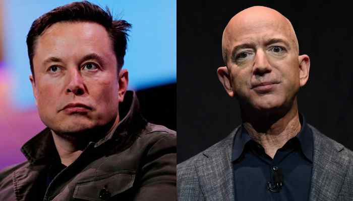 Tesla CEO Elon Musk and Amazon  founder Jeff Bezos party head at F1 racing event. — AFP/File