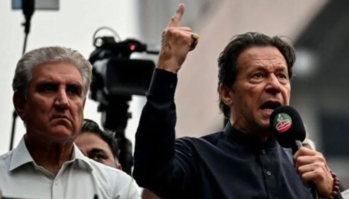 PTI founder Imran Khan (right) and Vice-Chairman Shah Mahmood Qureshi during a public gathering in this undated photo. — AFP