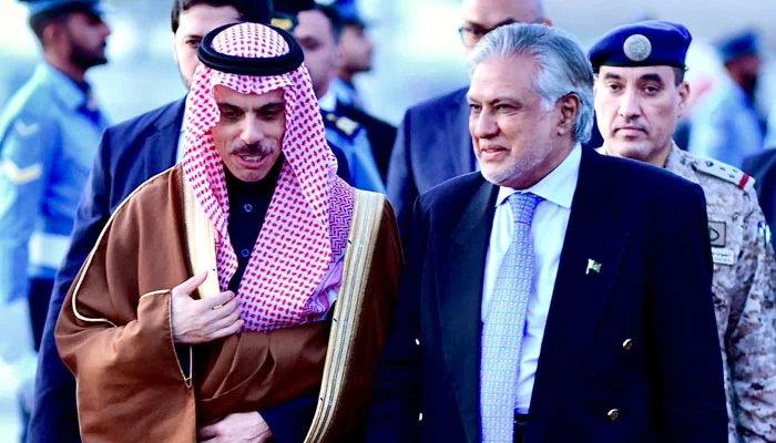 Saudi Foreign Minister Prince Faisal Bin Farhan Al Saud (left) speaks with FM Ishaq Dar following his arrival at the Nur Khan Airbase Rawalpindi on April 15, 2024. — X/@ForeignOfficePk