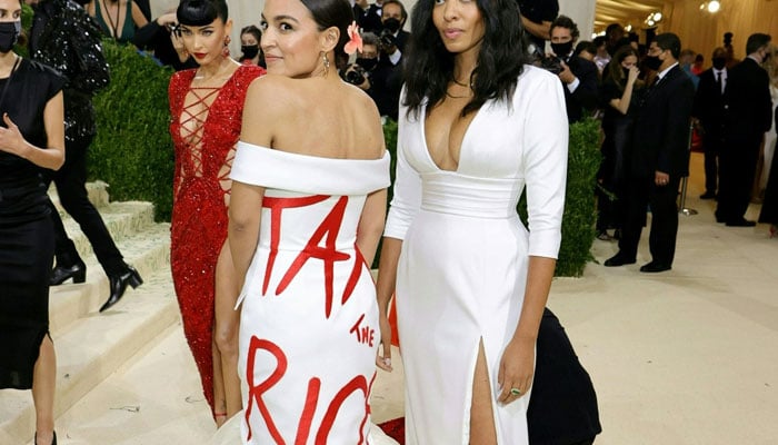 Alexandria Ocasio-Cortez in “that” dress with Aurora James at The 2021 Met Gala in New York. — AFP File