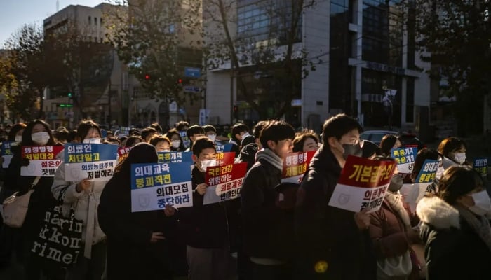 A group of trainee doctors and others at a rally in Seoul to protest against President Yoon Suk Yeol on December 8, 2024. —AFP