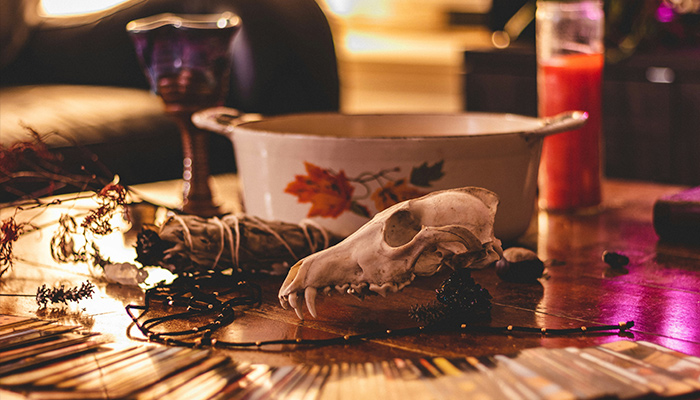 A representational image of a table set with witchcraft supplies. — Pixabay