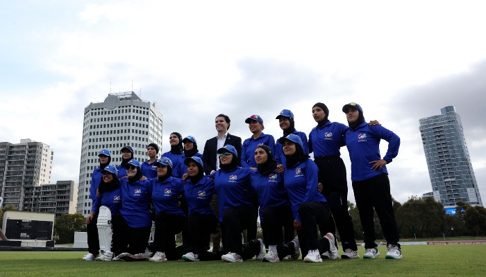 Afghanistan Womens XI players pose for a team photo during the cricket match between Afghanistan Womens XI and Cricket Without Borders XI at Junction Oval in Melbourne on January 30, 2025. — AFP