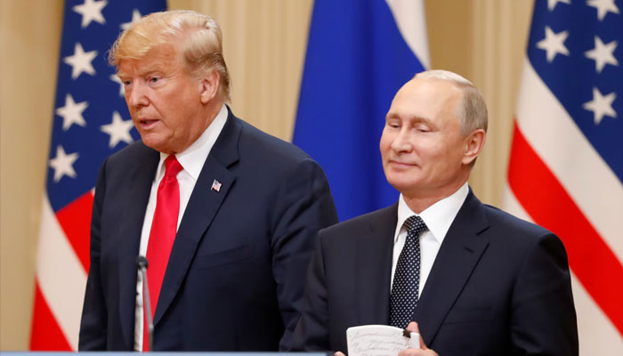 US President Donald Trump (left) and his Russian counterpart President Putin arrive for a joint news conference. — Reuters/File