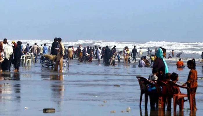 People cool off in the hot weather at sea view beach in Karachi on September 24, 2023. — PPI