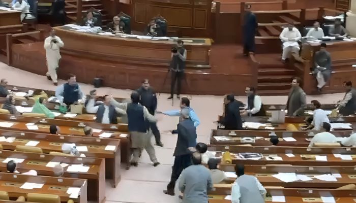 Opposition lawmaker Khalid Nisar Dogar slaps government lawmaker Hassan Riaz during the session of Punjab Assembly on July 28, 2025. — Screengrab via Geo News