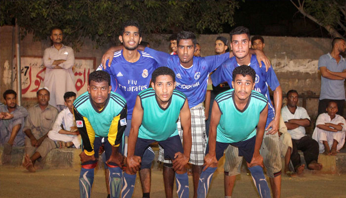 Young footballers of Lyari posing for photo. —TheNews/File