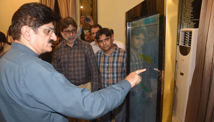 Sindh Chief Minister Syed Murad Ali Shah reviews real-time water flows at Guddu and Sukkur barrages on a digital touch-screen, accompanied by Secretary Irrigation Zareef Khero, August 31, 2025.—Facebook@SindhCMHouse